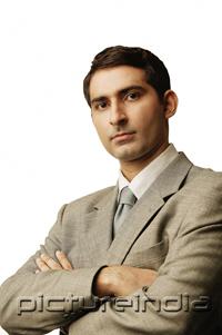 PictureIndia - Businessman, looking at camera, arms crossed