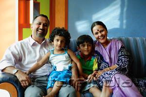 PictureIndia - Family with two children, smiling at camera