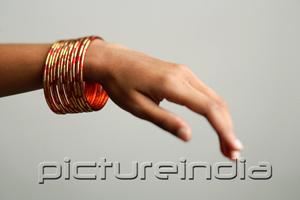 PictureIndia - Close-up of woman's hand with bangles