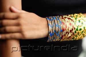 PictureIndia - Woman's arm with colourful bangles